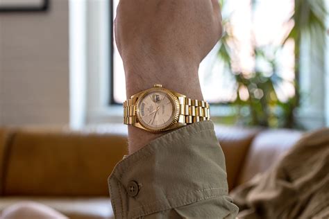 rolex day date gold on wrist